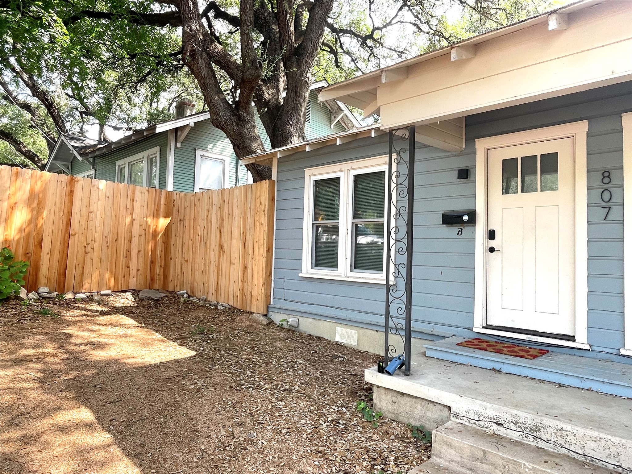 807 East Riverside Drive, Unit B Austin, TX 78704 - Photo 3 of 28 A welcoming front porch with simple landscaping leads to a classic entry.