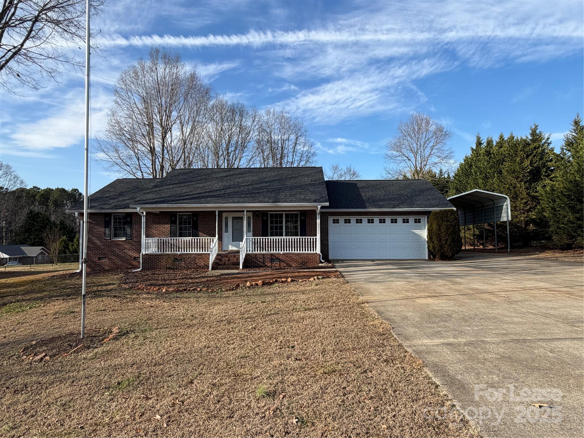 401 Miller Farm Road Statesville, NC 28625 - Photo 1 of 18 a front view of a house with a garden
