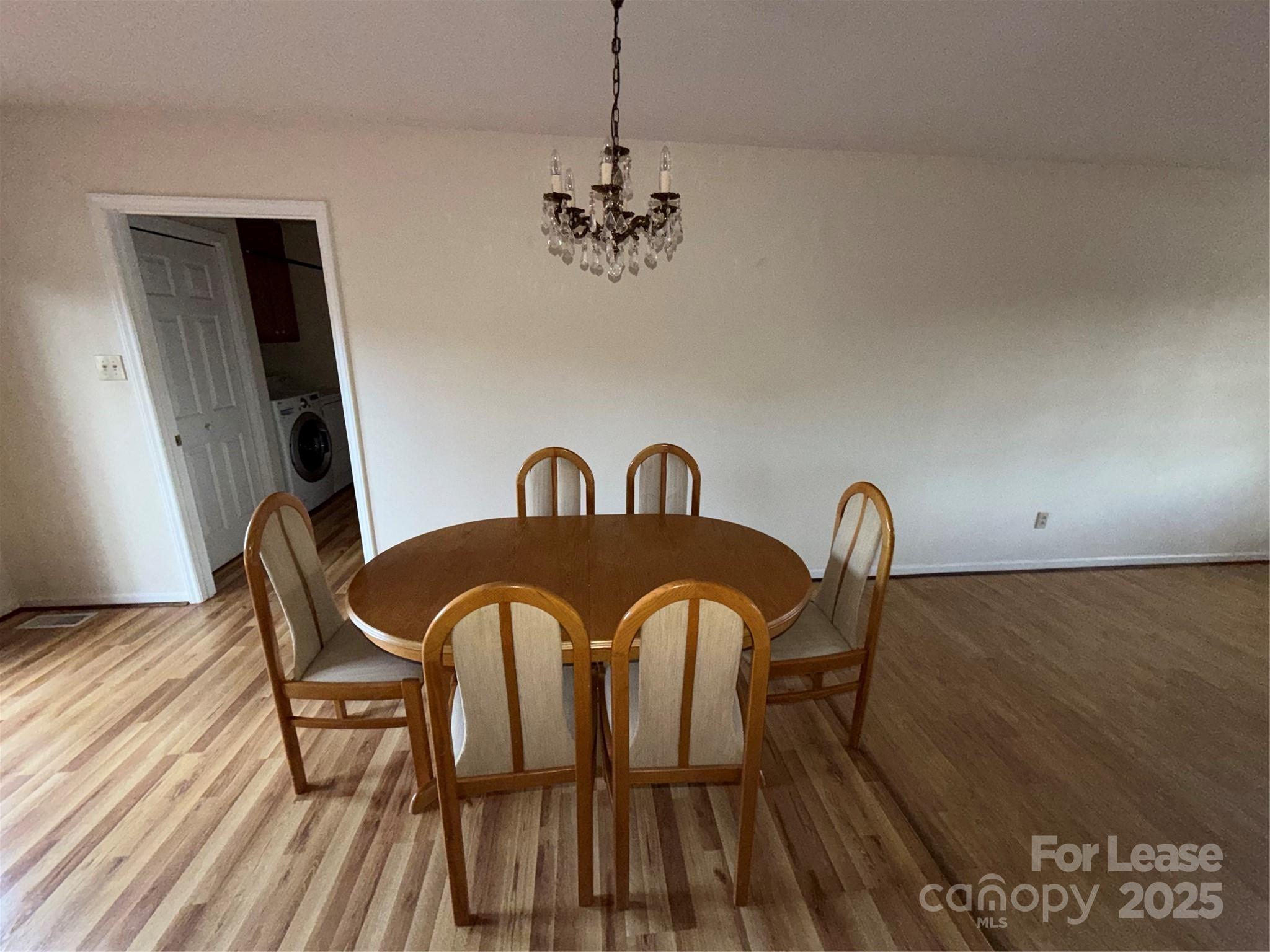 401 Miller Farm Road Statesville, NC 28625 - Photo 13 of 18 a view of a dining room with furniture and wooden floor