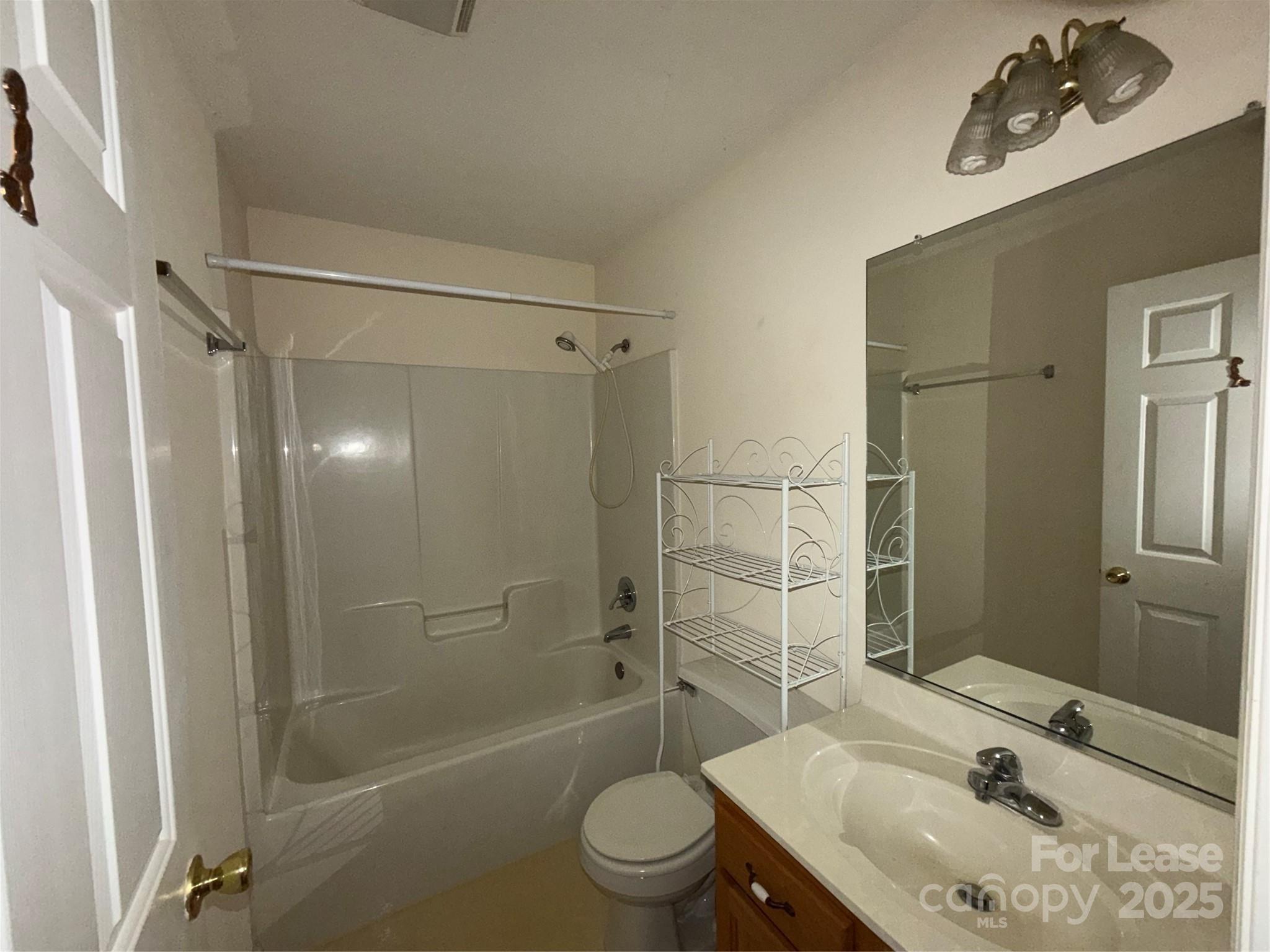 401 Miller Farm Road Statesville, NC 28625 - Photo 7 of 18 a bathroom with a sink toilet and shower