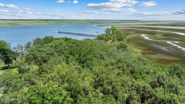 a view of a lake with a yard