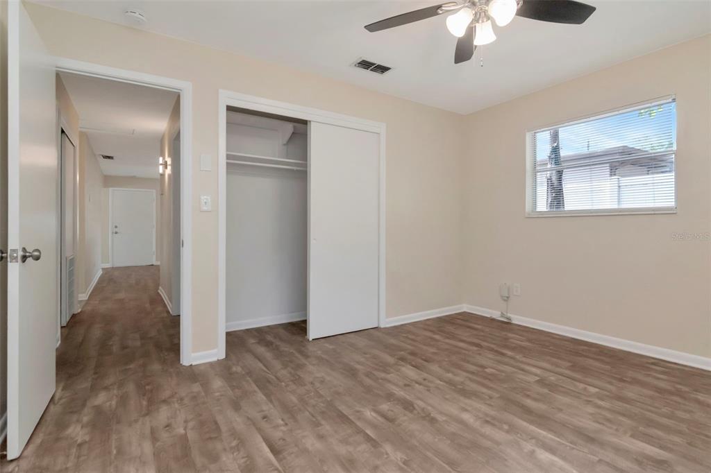 126 Kingsway Road Brandon, FL 33510 - Photo 28 of 42 a view of an empty room with a chandelier fan