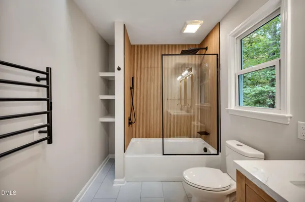 a bathroom with a toilet a sink and a bathtub