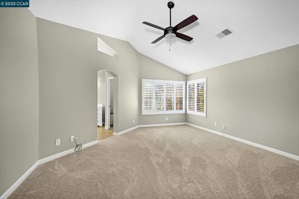 a view of an empty room with a window