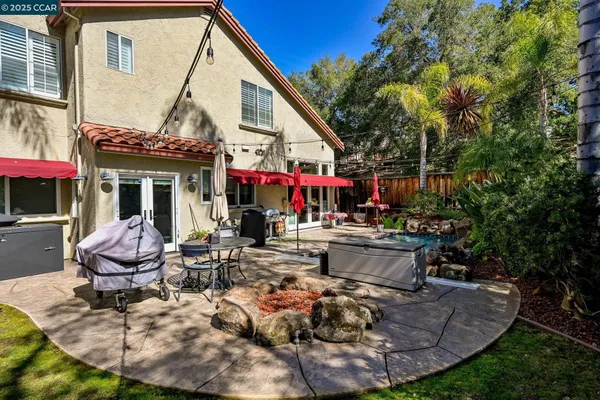 a view of a chairs and tables in a patio