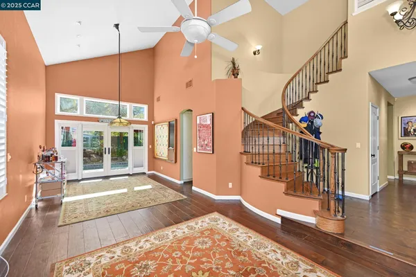 a view of an entryway with wooden floor