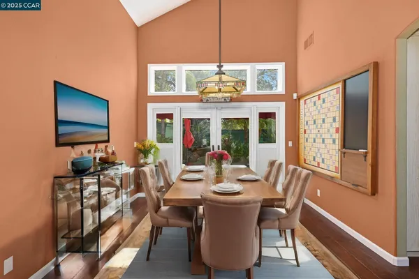 a view of a dining room with furniture window and outside view