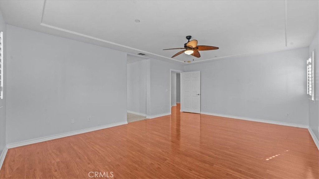 5448 Turin Way Fontana, CA 92336 - Photo 15 of 40 a view of empty room with wooden floor