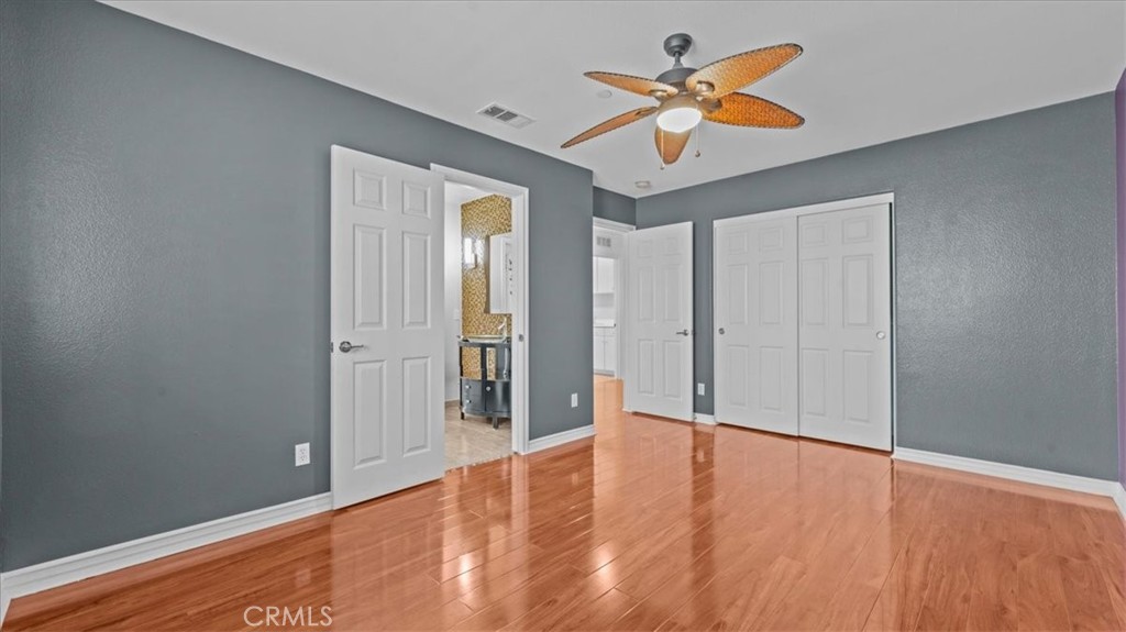 5448 Turin Way Fontana, CA 92336 - Photo 23 of 40 wooden floor in an empty room with a window