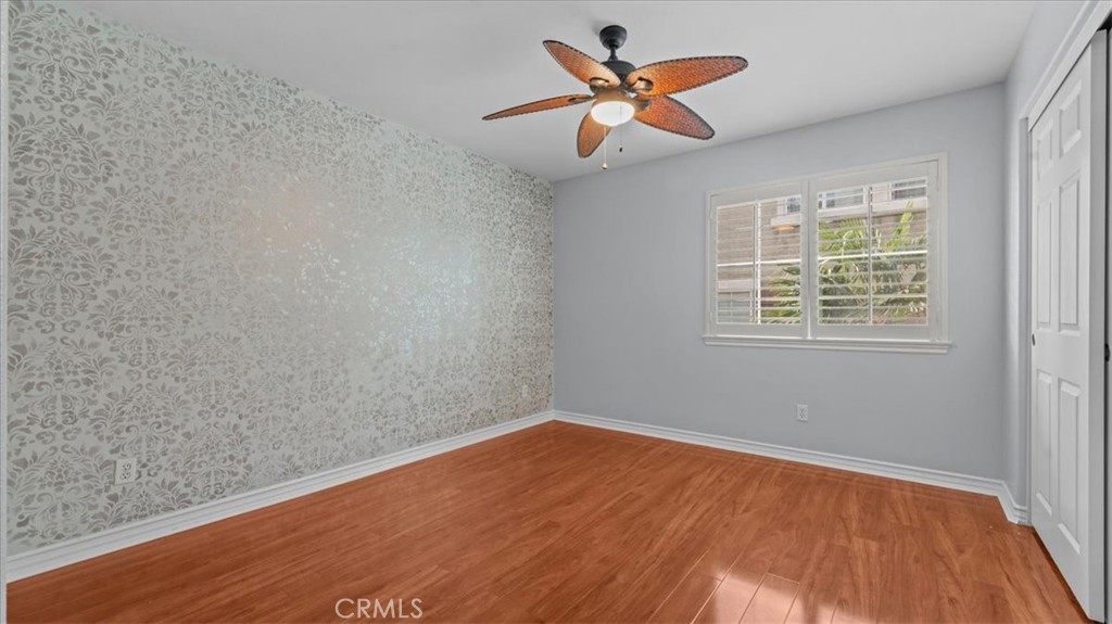 5448 Turin Way Fontana, CA 92336 - Photo 25 of 40 wooden floor in an empty room with a window