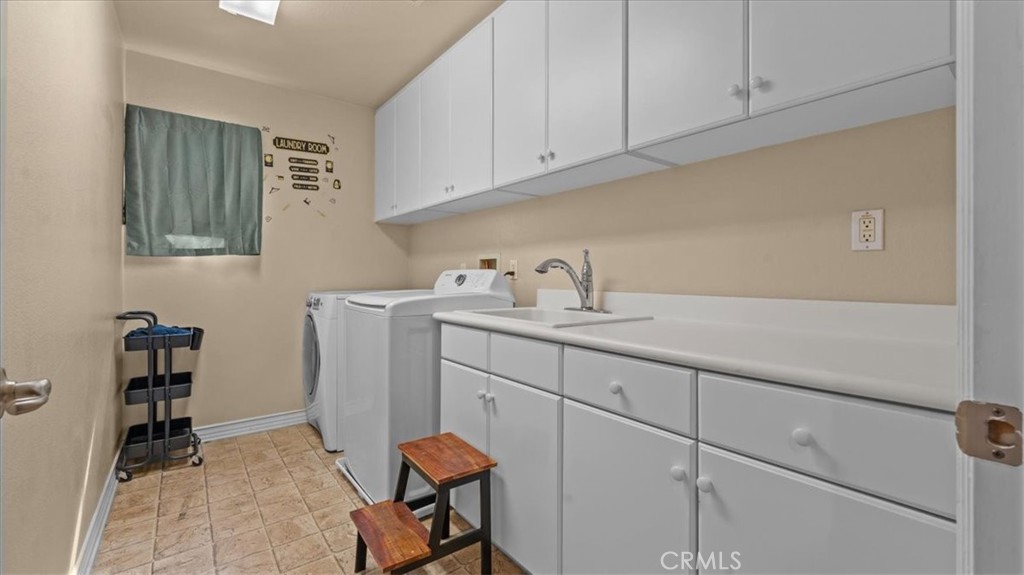 5448 Turin Way Fontana, CA 92336 - Photo 27 of 40 a view with cabinets a sink and dishwasher in it