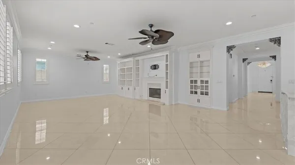 a view of an empty room with a cabinet