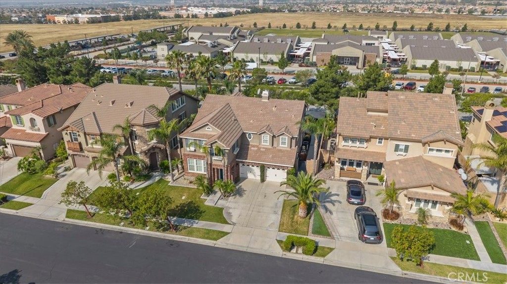 5448 Turin Way Fontana, CA 92336 - Photo 33 of 40 an aerial view of residential houses with outdoor space and parking