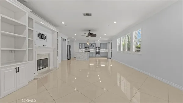 a lobby with furniture and fireplace