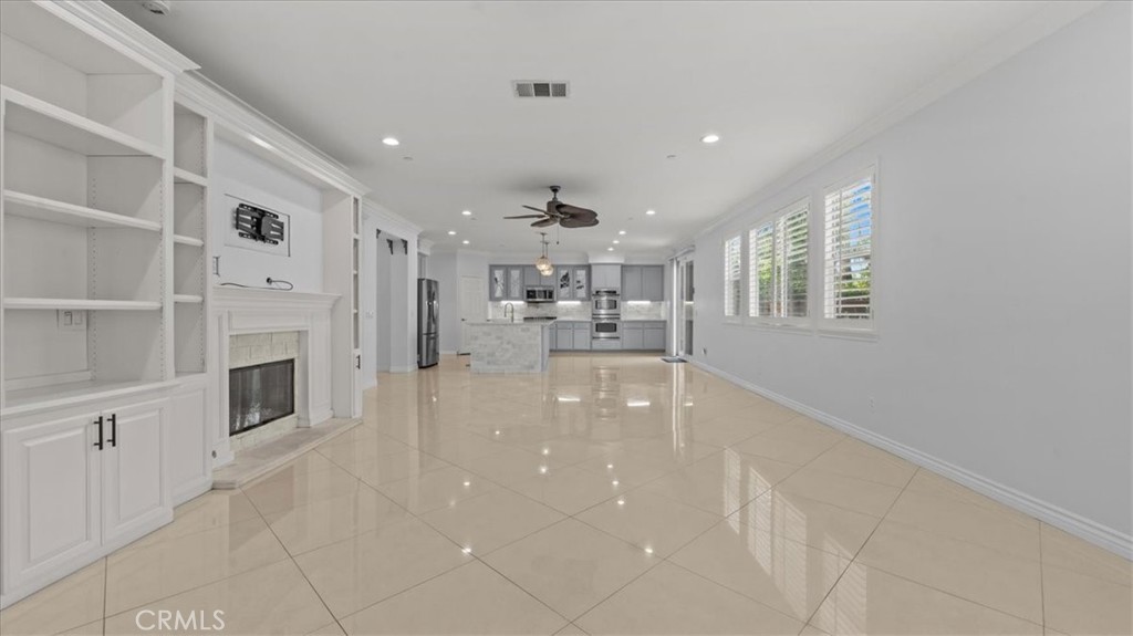 5448 Turin Way Fontana, CA 92336 - Photo 5 of 40 a lobby with furniture and fireplace