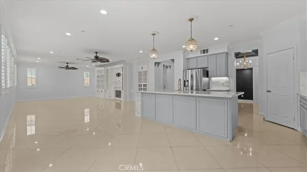 a large kitchen with cabinets and stainless steel appliances