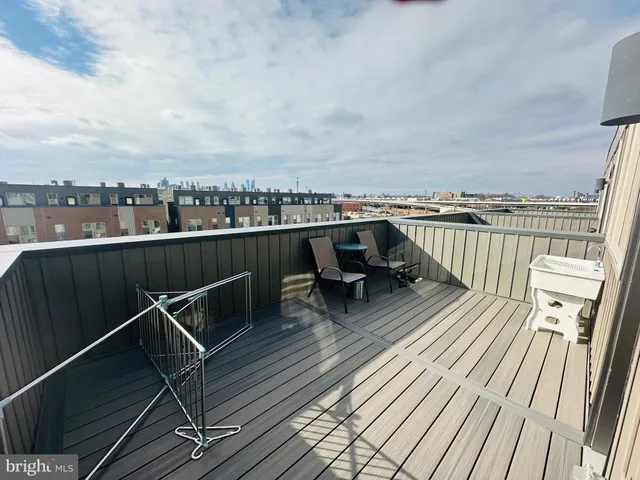 a view of roof deck with patio