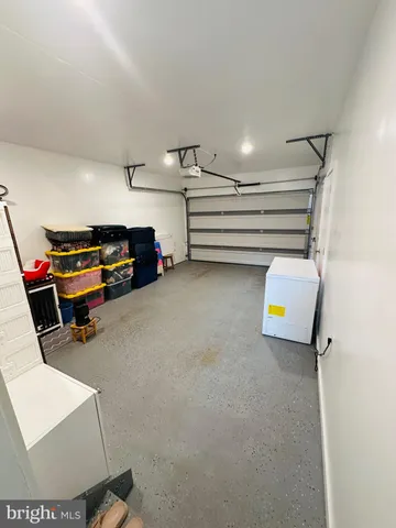 a view of room with furniture and a couch