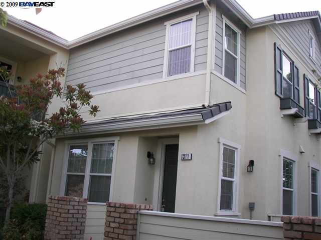 1311 Nancy Lane San Ramon, CA 94582 - Photo 1 of 1 a view of a house with a large windows and flower plants