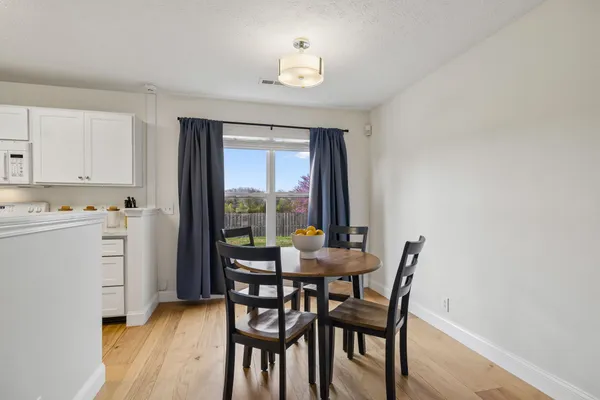 a kitchen with a sink and a refrigerator