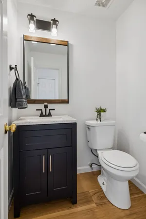 a en suite bathroom with a double vanity sink and a mirror