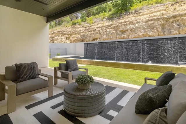 a view of swimming pool with lounge chair