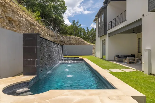 an aerial view of a house with a swimming pool