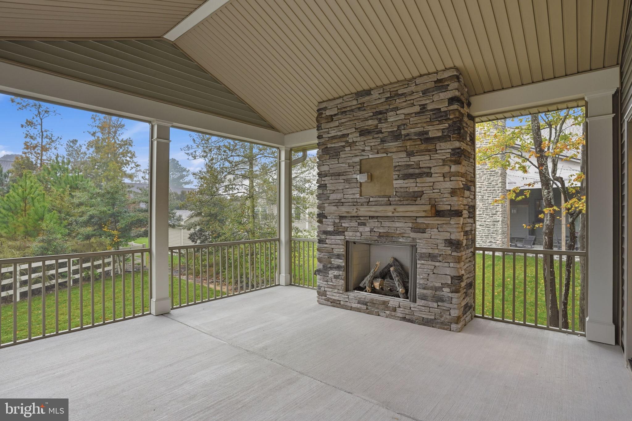 25015 Prairie Lane, Unit 3 Millsboro, DE 19966 - Photo 20 of 42 a view of livingroom with furniture and floor to ceiling window