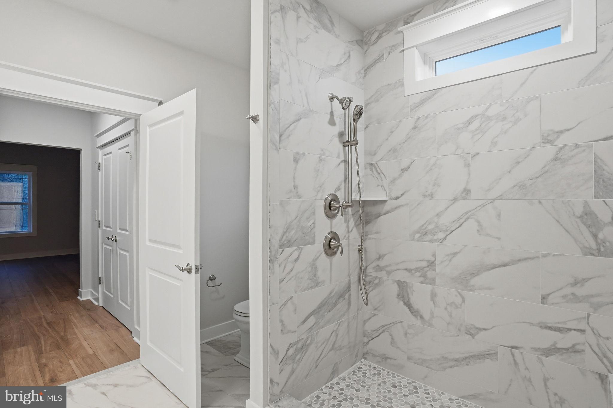 25015 Prairie Lane, Unit 3 Millsboro, DE 19966 - Photo 27 of 42 a bathroom with a shower