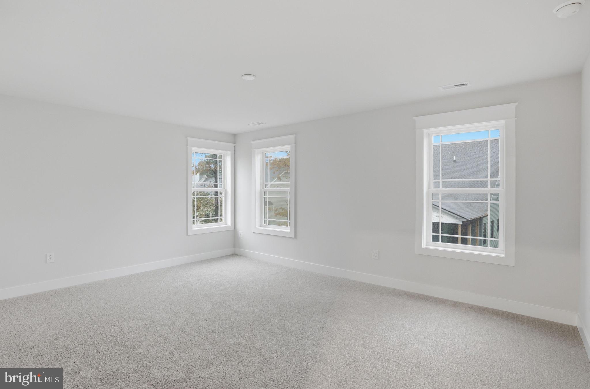 25015 Prairie Lane, Unit 3 Millsboro, DE 19966 - Photo 30 of 42 an empty room with windows