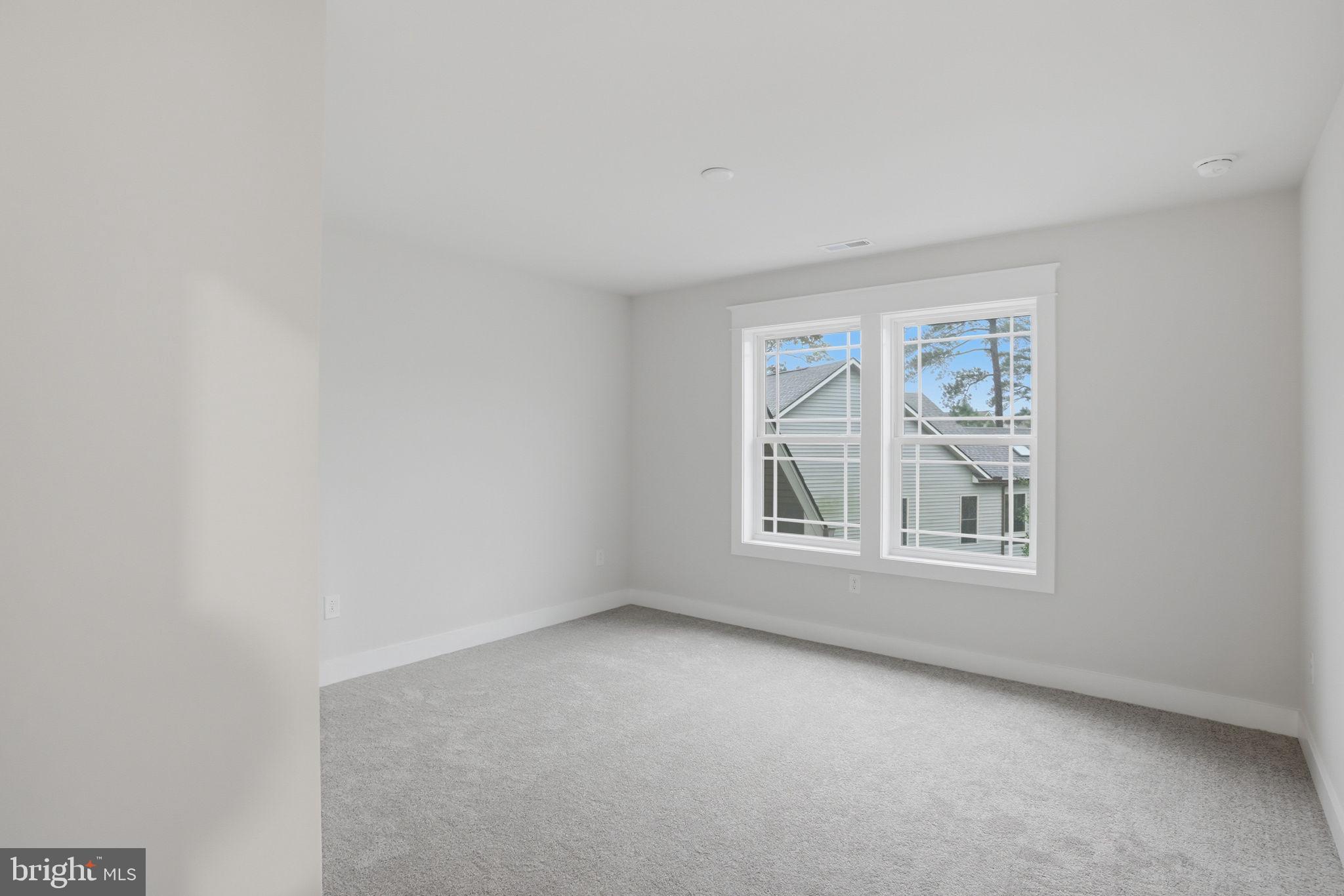 25015 Prairie Lane, Unit 3 Millsboro, DE 19966 - Photo 34 of 42 an empty room with a window