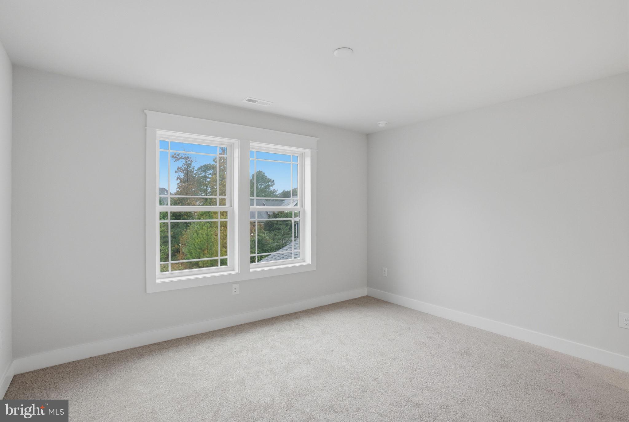 25015 Prairie Lane, Unit 3 Millsboro, DE 19966 - Photo 35 of 42 an empty room with a window