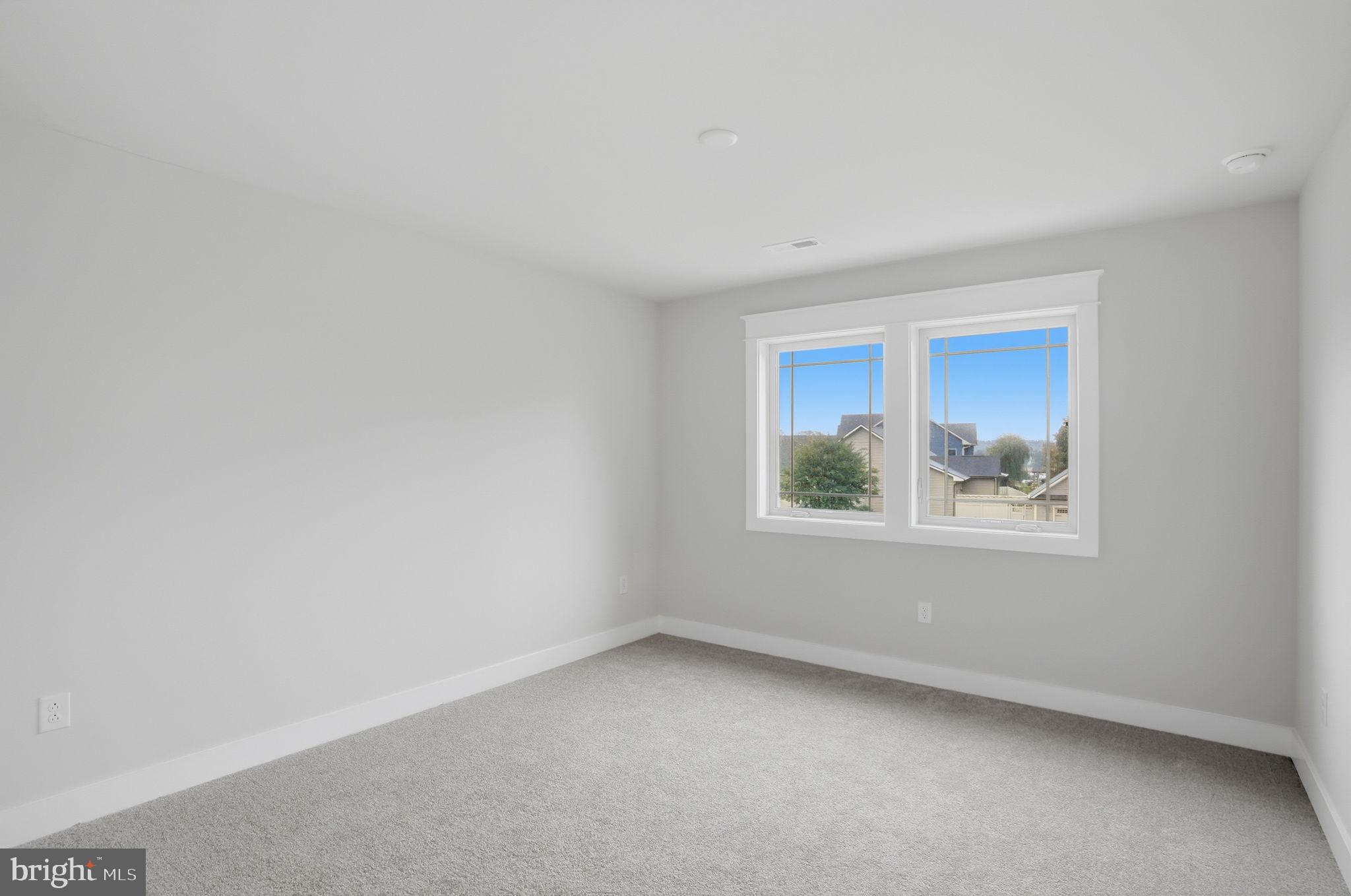 25015 Prairie Lane, Unit 3 Millsboro, DE 19966 - Photo 36 of 42 an empty room with a window