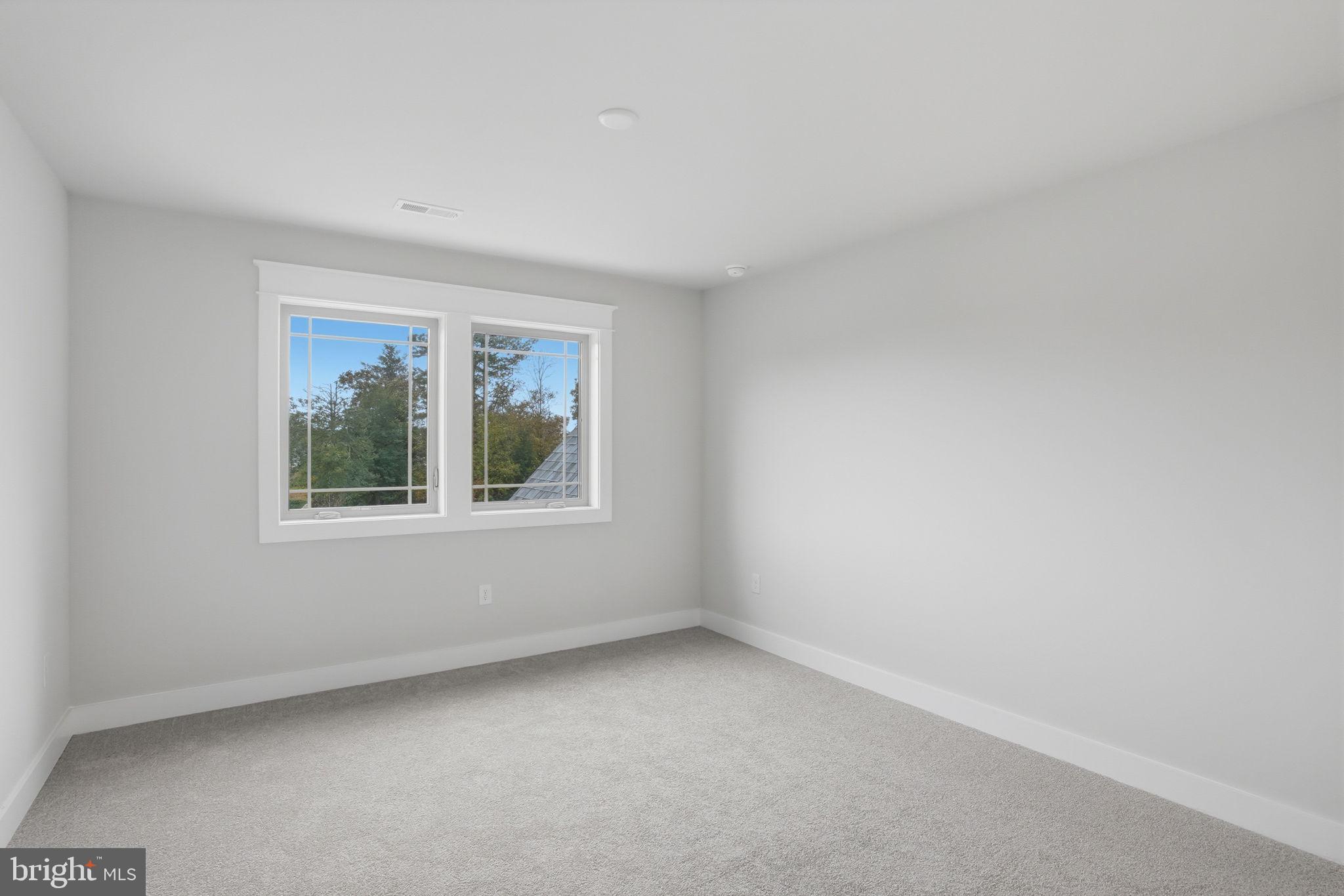 25015 Prairie Lane, Unit 3 Millsboro, DE 19966 - Photo 37 of 42 an empty room with a window