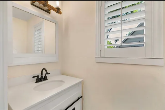 a close view of a sink and a mirror