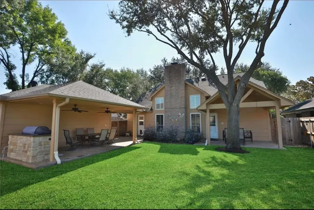 a front view of house with yard and green space