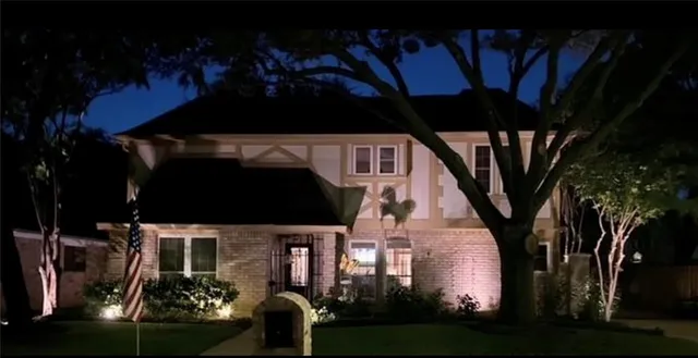 a view of a house with backyard porch and sitting area