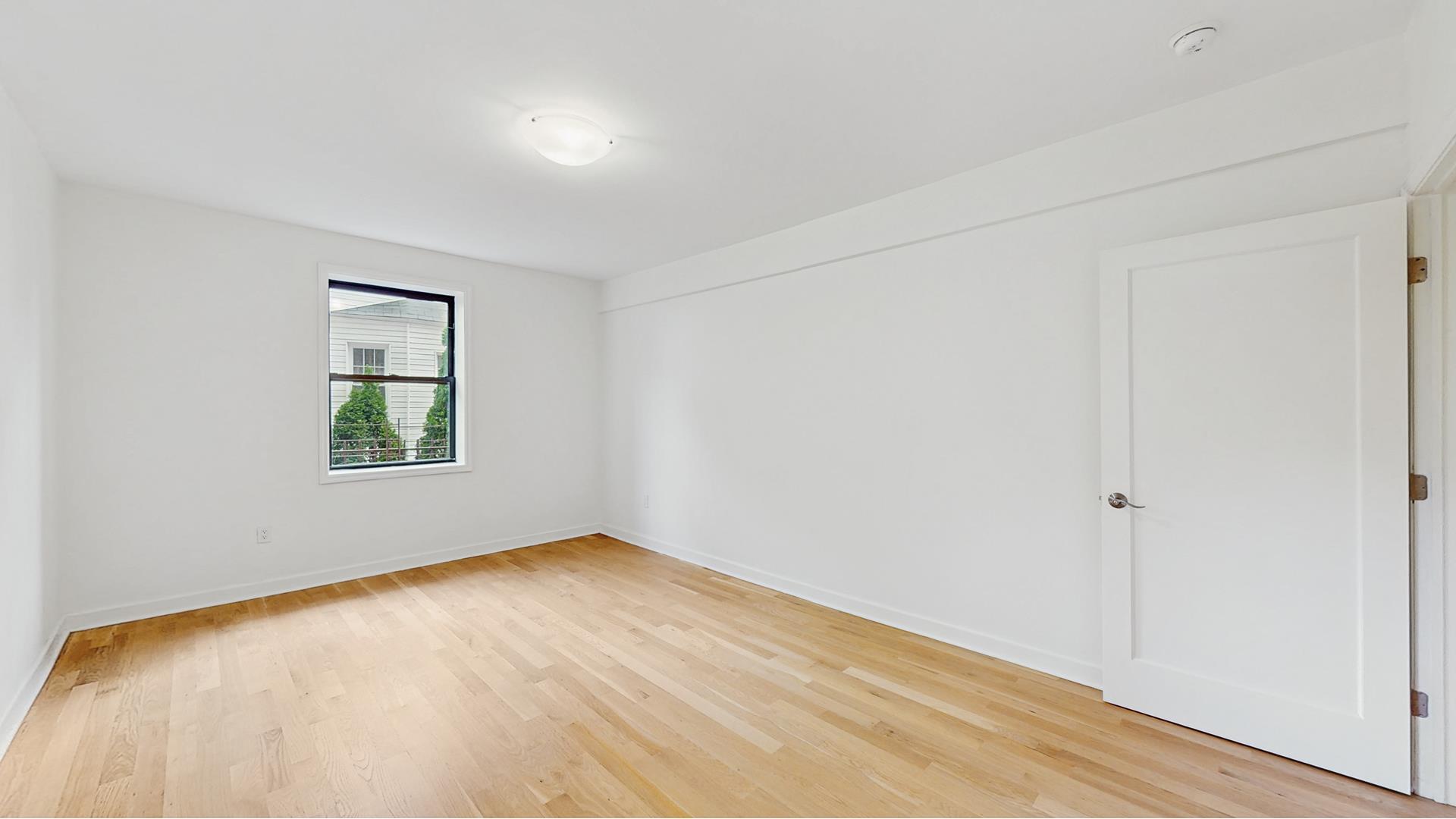 811 Cortelyou Road, Unit 1J Brooklyn, NY 11218 - Photo 11 of 15 an empty room with window