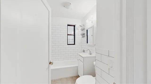 a bathroom with a toilet sink and bathtub