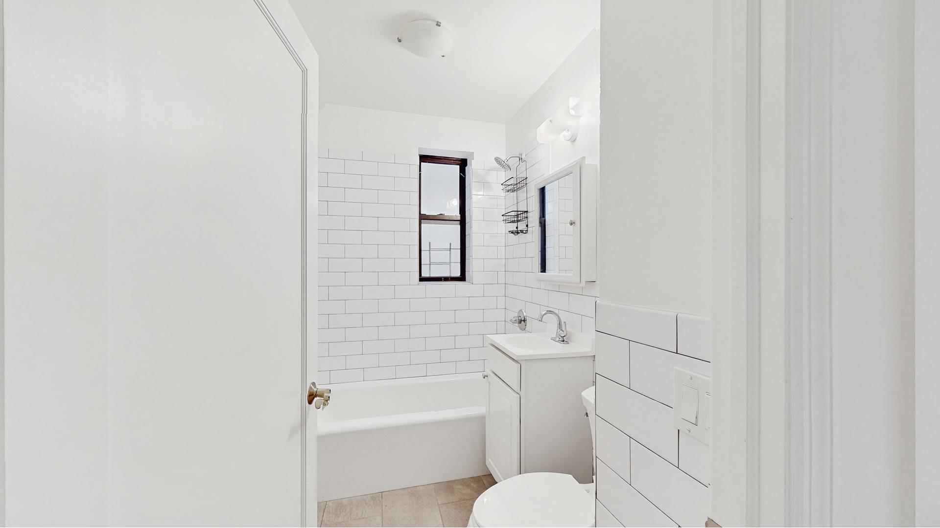 811 Cortelyou Road, Unit 1J Brooklyn, NY 11218 - Photo 12 of 15 a bathroom with a toilet sink and bathtub