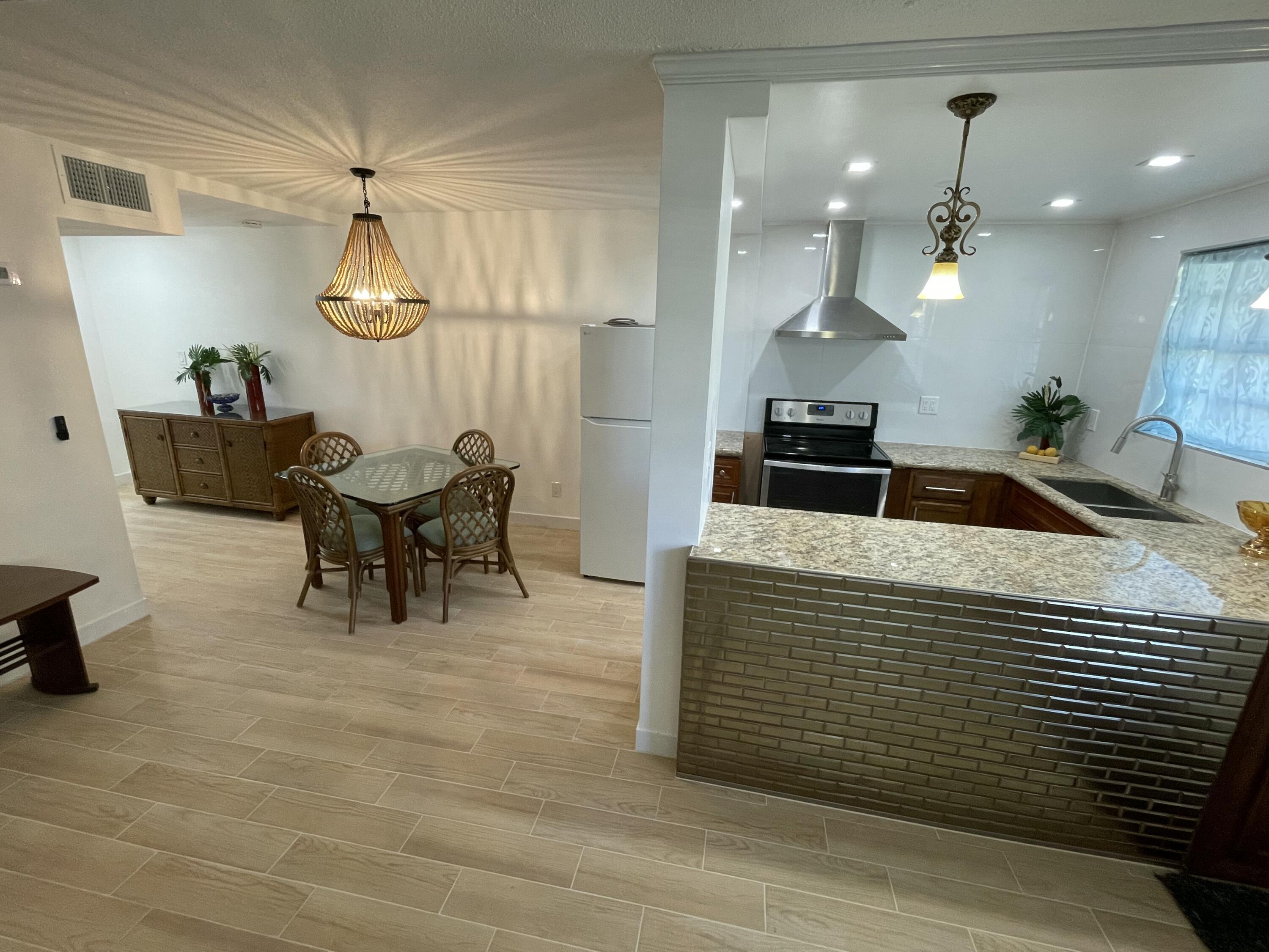 30 Southeast 13th Street, Unit A2 Boca Raton, FL 33432 - Photo 1 of 26 Kitchen and Dining