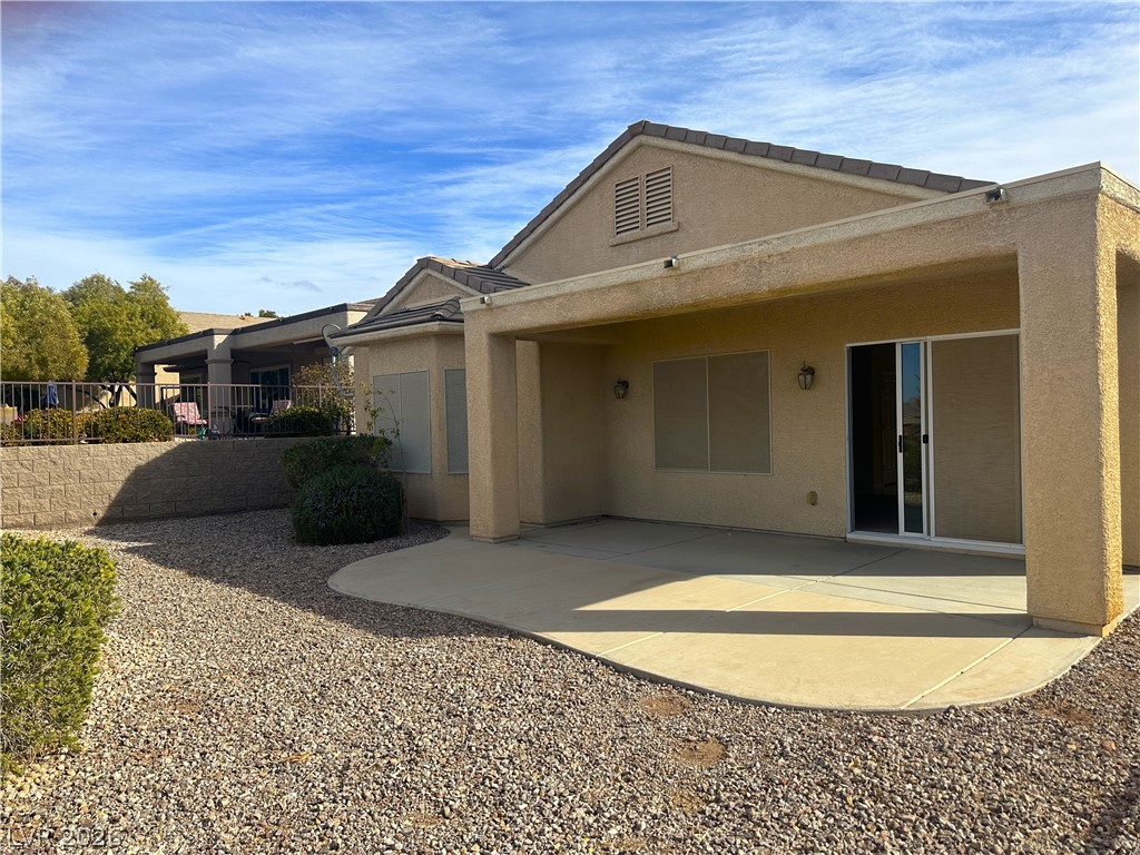3034 Canal Walk Road Henderson, NV 89052 - Photo 18 of 24 Enjoy outdoor living with this expansive patio and meticulously maintained yard space.