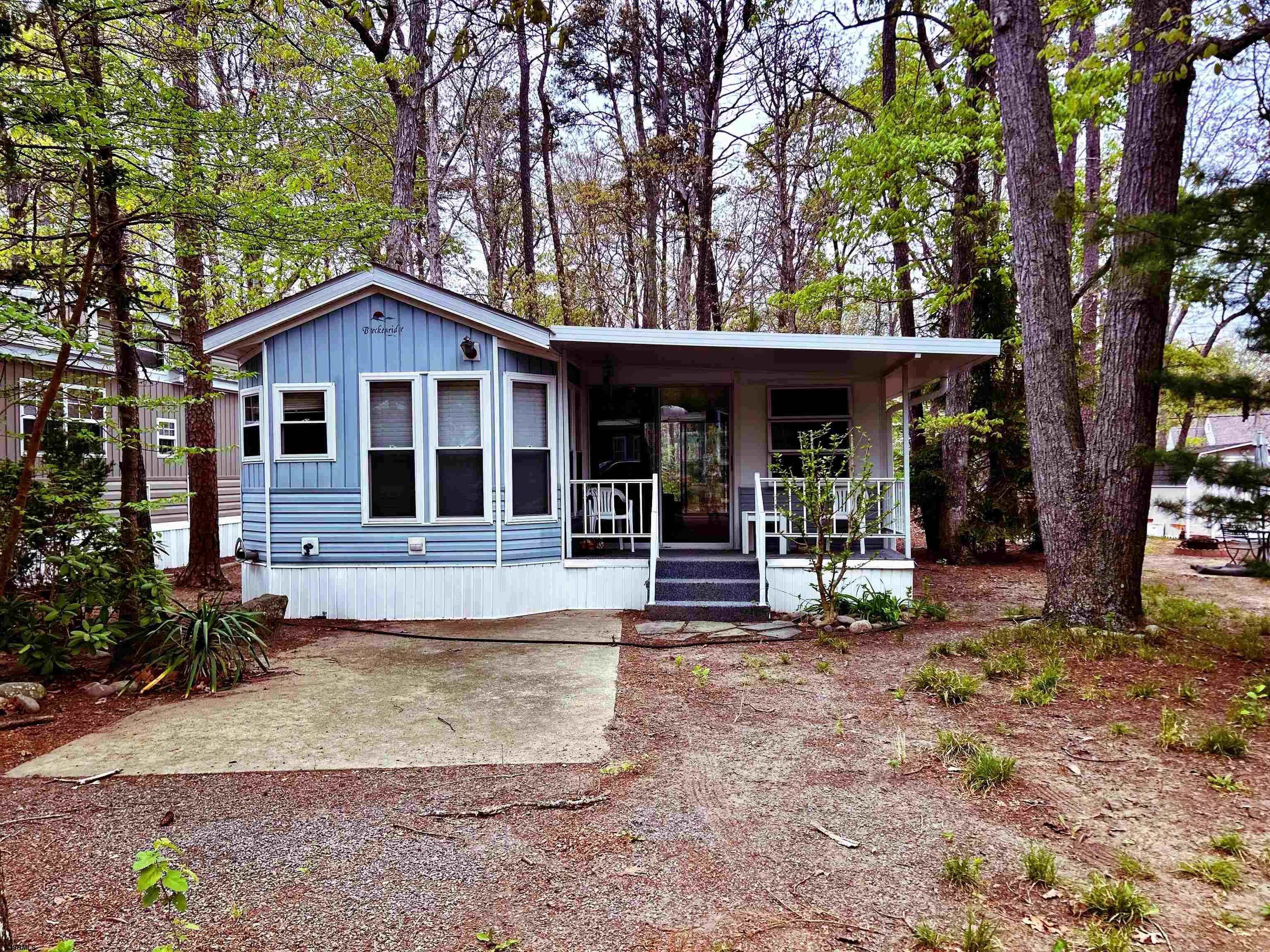 a view of a house with a yard porch and sitting area