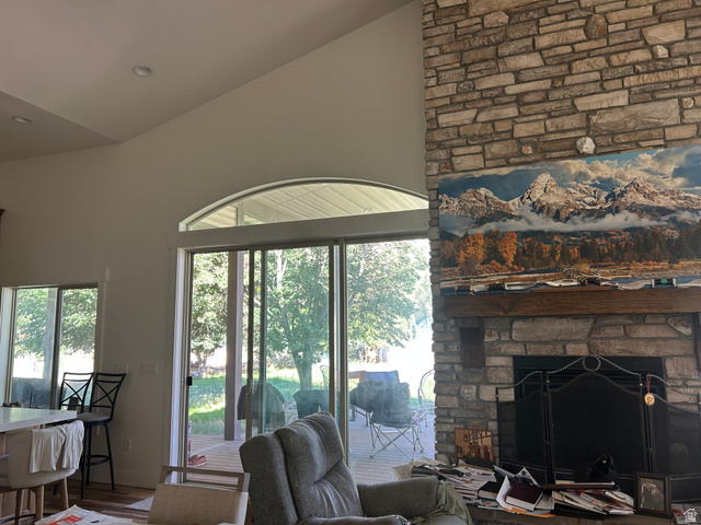 2688 Read Lane Preston, ID 83263 - Photo 7 of 18 Stone fireplace with a substantial wood mantel, featuring a built-in fire screen