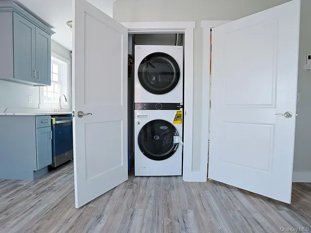 a view of a hallway with washer and dryer