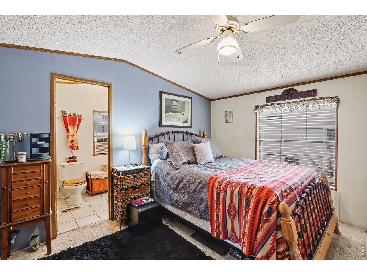 1401 9th Street, Unit 159 Fort Lupton, CO 80621 - Photo 5 of 24 Primary bedroom with double closets and an ensuite bathroom.