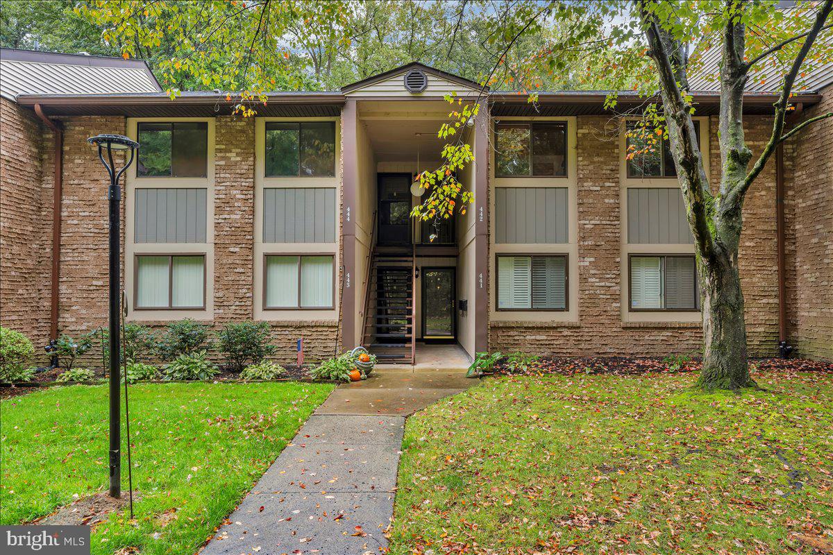 115 East Kings Highway, Unit 443 Maple Shade, NJ 08052 - Photo 1 of 24 a front view of a house with garden
