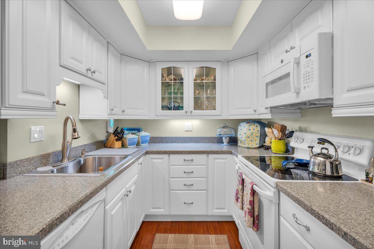 115 East Kings Highway, Unit 443 Maple Shade, NJ 08052 - Photo 12 of 24 a kitchen with cabinets appliances a sink and a counter top space