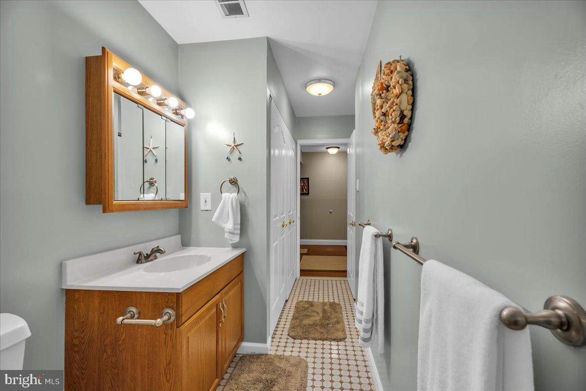 115 East Kings Highway, Unit 443 Maple Shade, NJ 08052 - Photo 16 of 24 a bathroom with a sink and a mirror