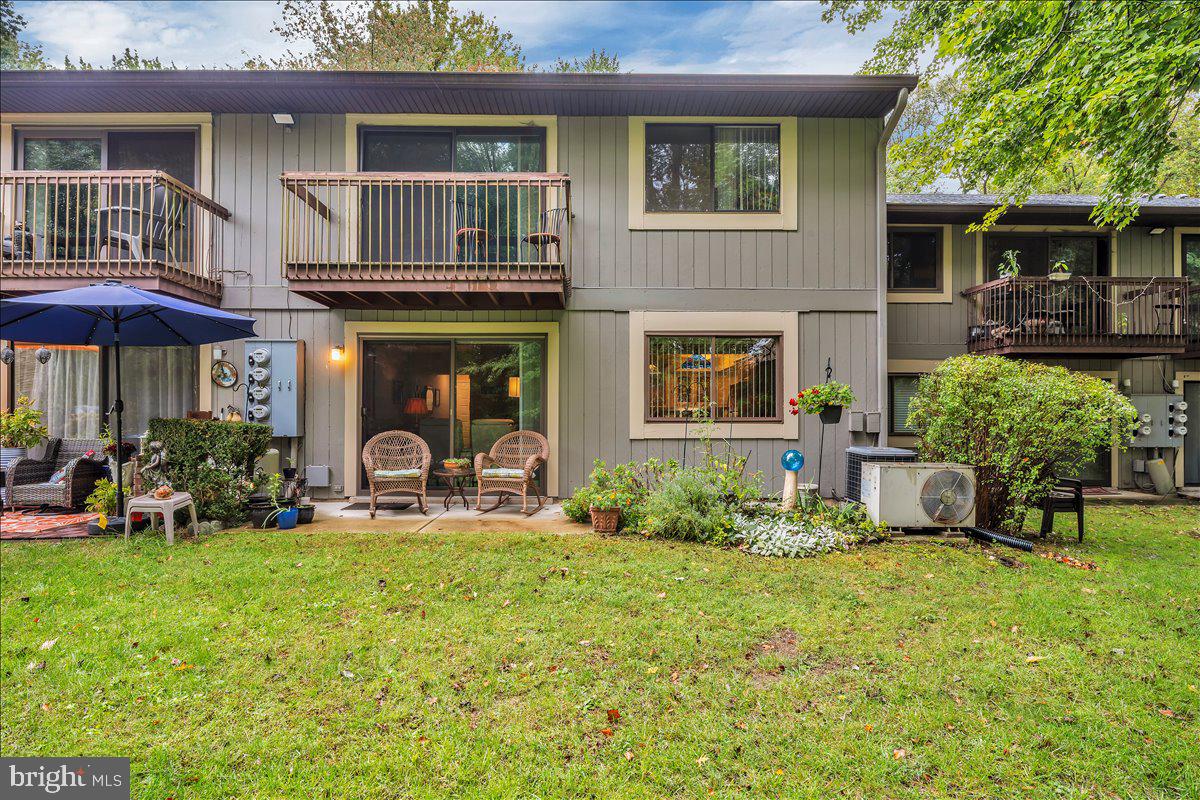 115 East Kings Highway, Unit 443 Maple Shade, NJ 08052 - Photo 22 of 24 a front view of a house with garden and porch